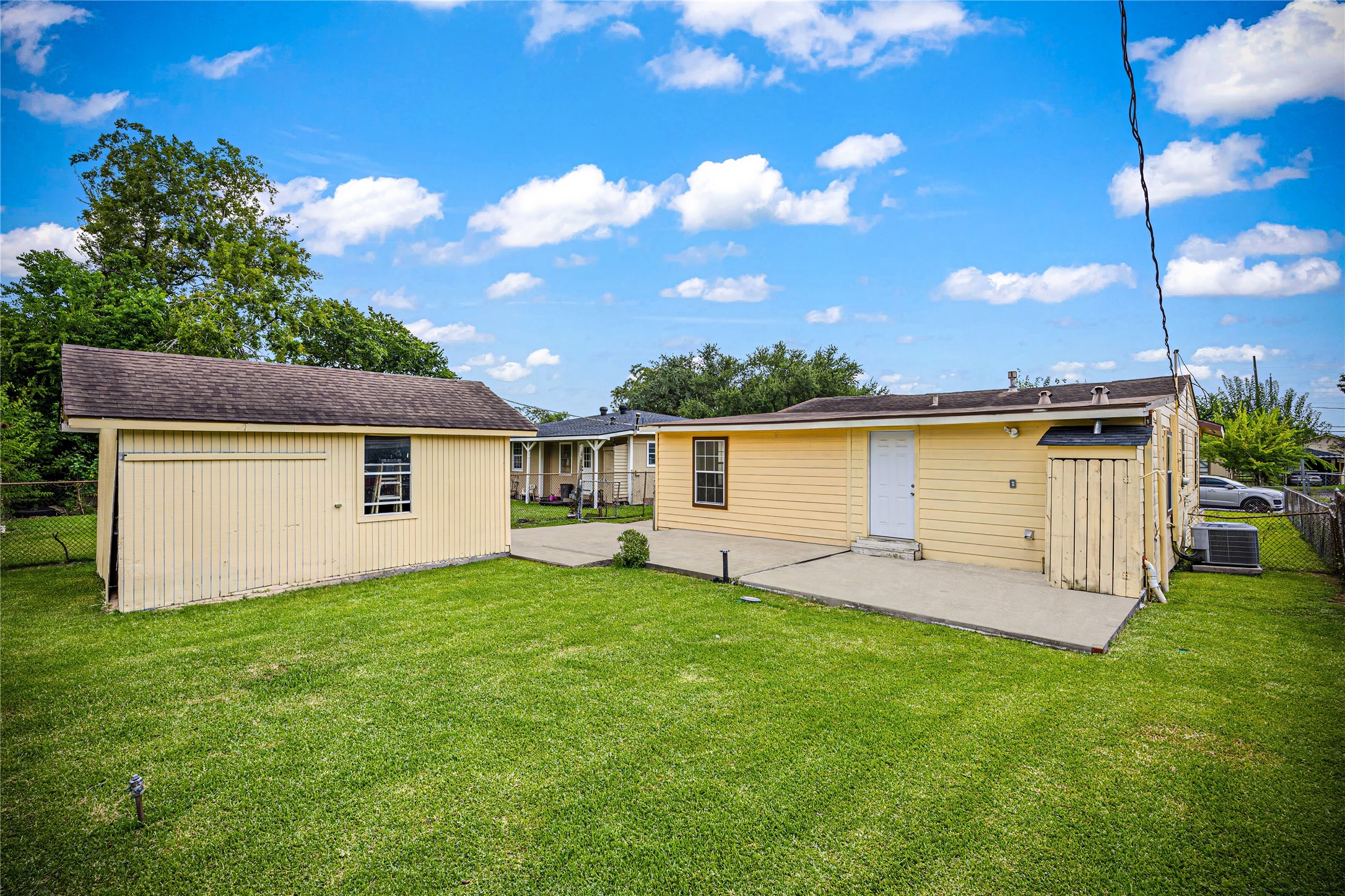 10221 Flaxman Street Houston, TX 77029 - Photo 20 of 20 a front view of a house with a yard and garage