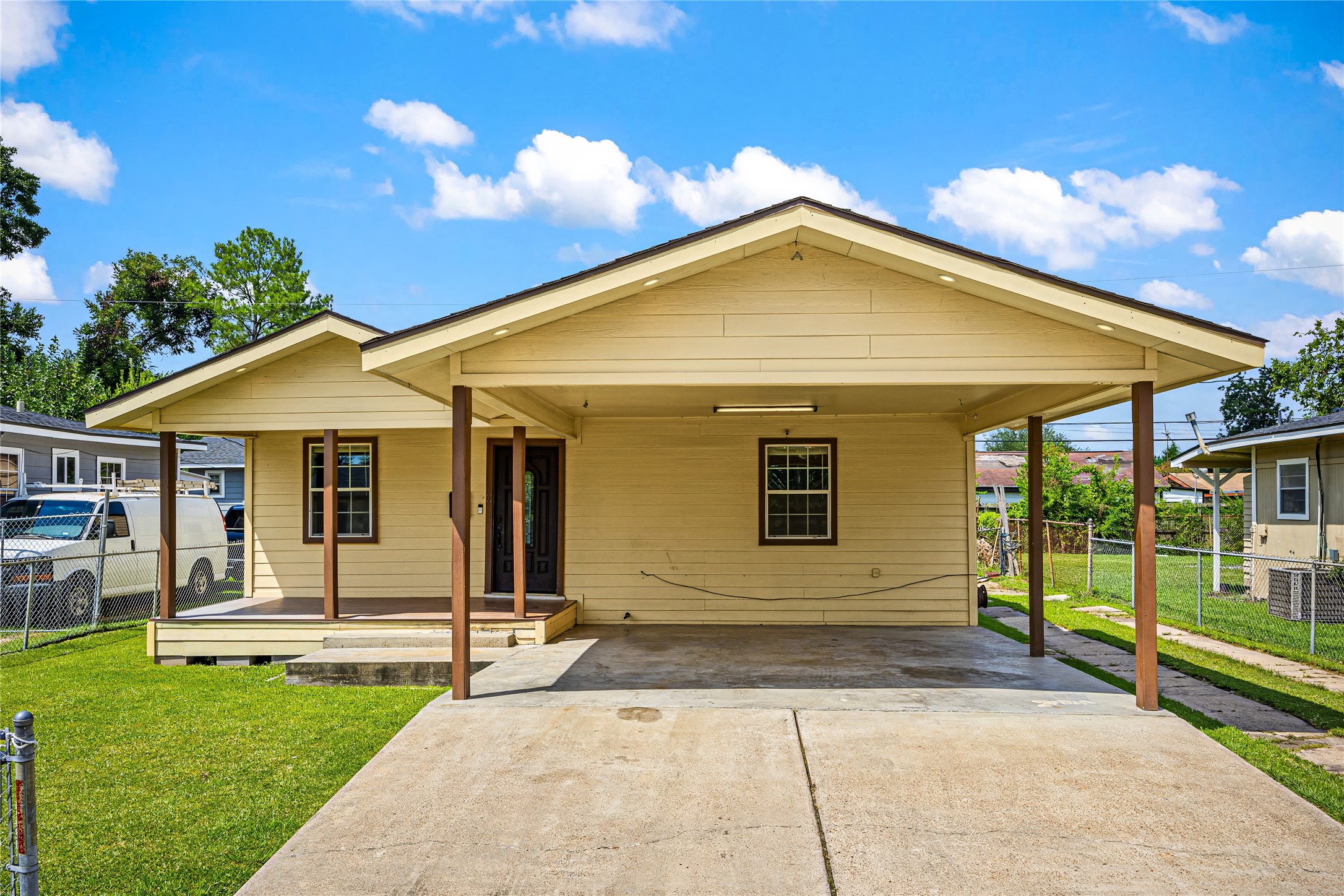 10221 Flaxman Street Houston, TX 77029 - Photo 4 of 20 a front view of a house with a yard