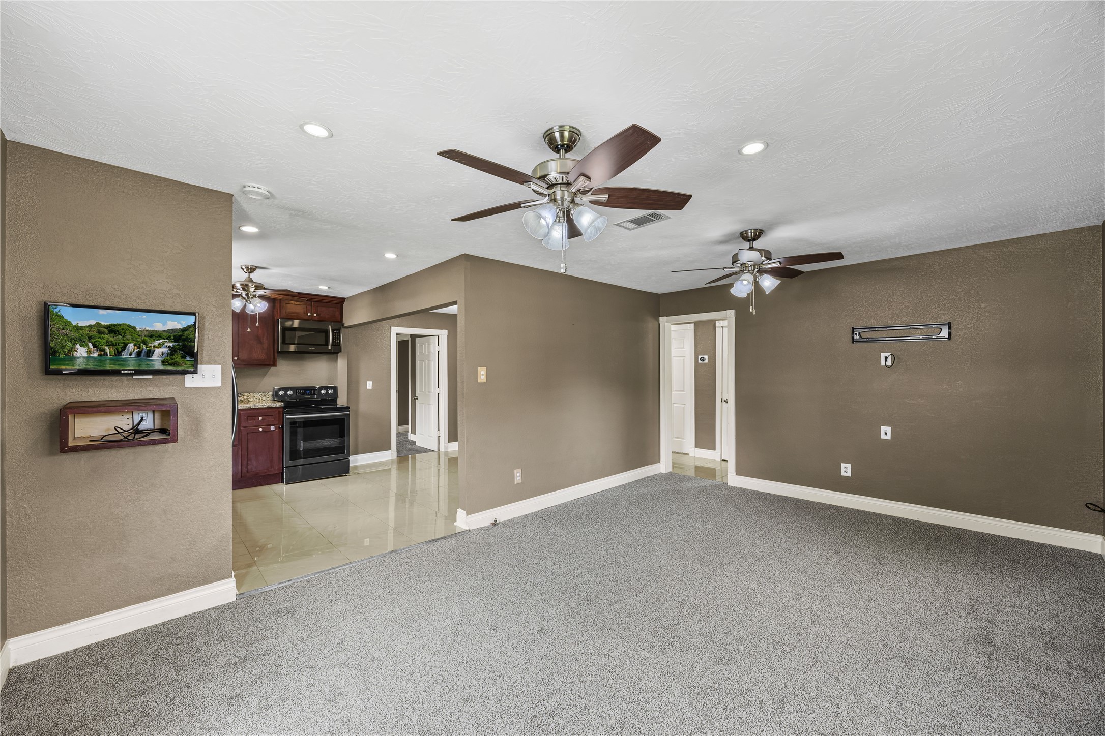 10221 Flaxman Street Houston, TX 77029 - Photo 6 of 20 wooden floor in an empty room with a window