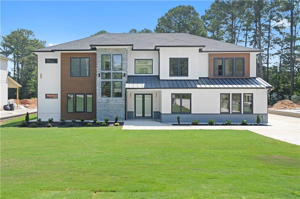 front view of a house with a yard