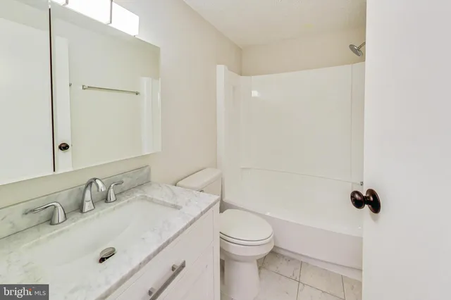 a view of balcony with wooden floor