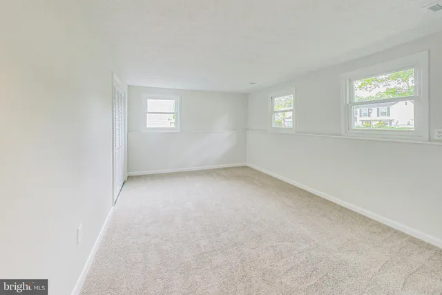 a view of empty room with windows