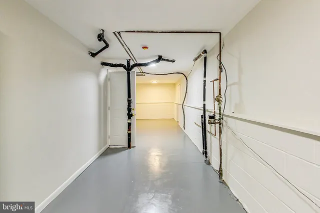 a view of a hallway with a white walls