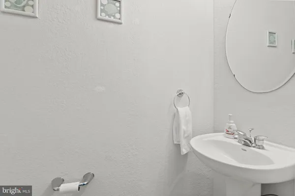 a bathroom with a sink and mirror