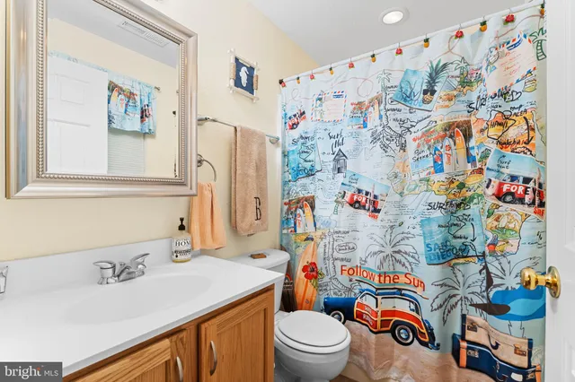 a bathroom with a sink toilet and vanity
