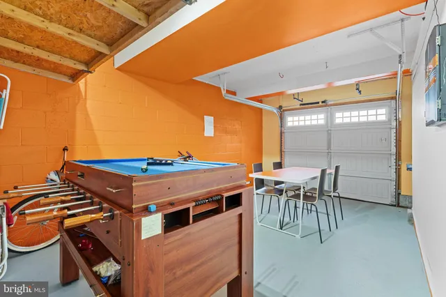 a view of a patio with table and chairs