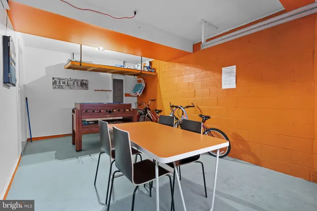 a kitchen with a table and chairs