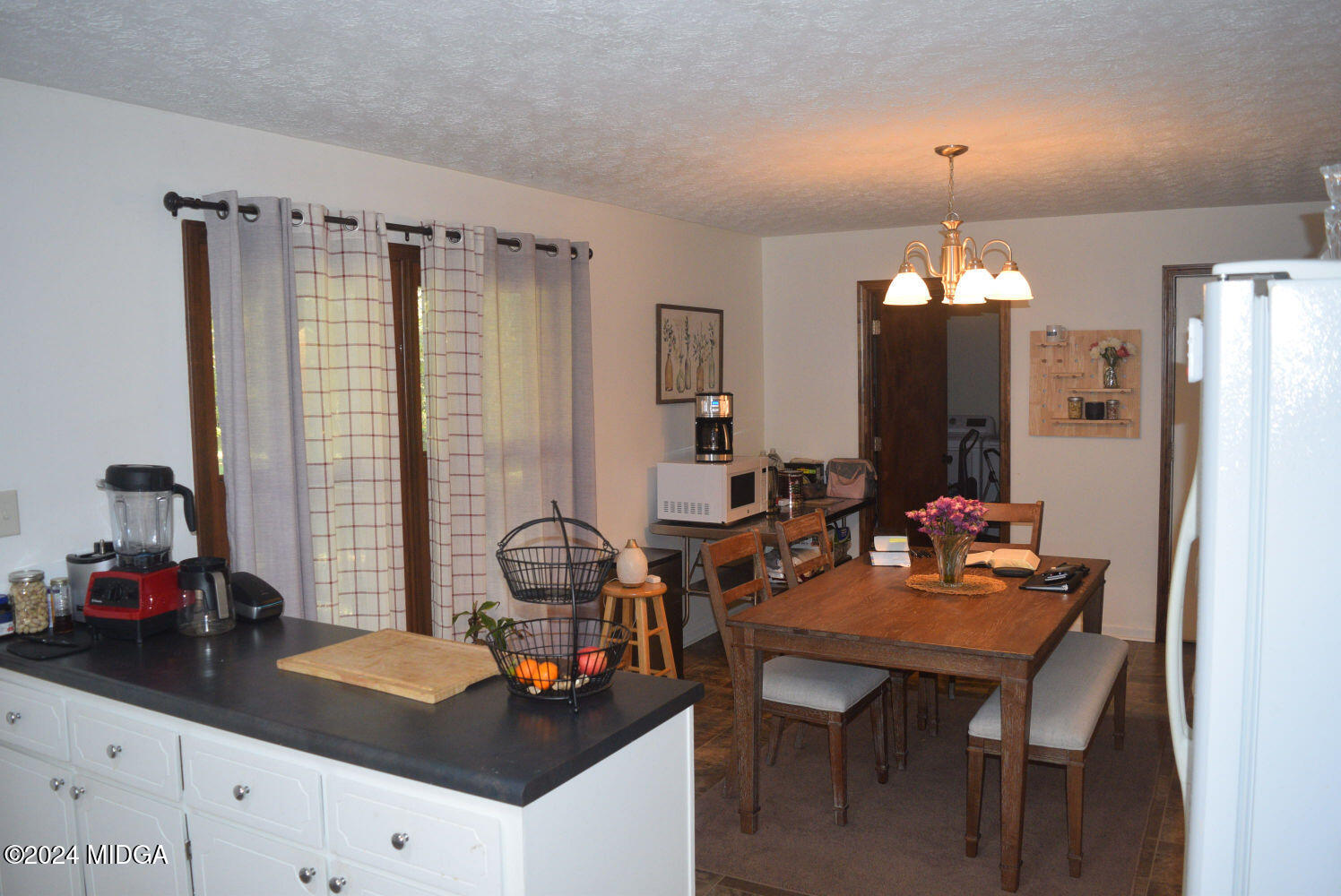 891 Walker Road Byron, GA 31008 - Photo 6 of 24 a dining room with table and chairs