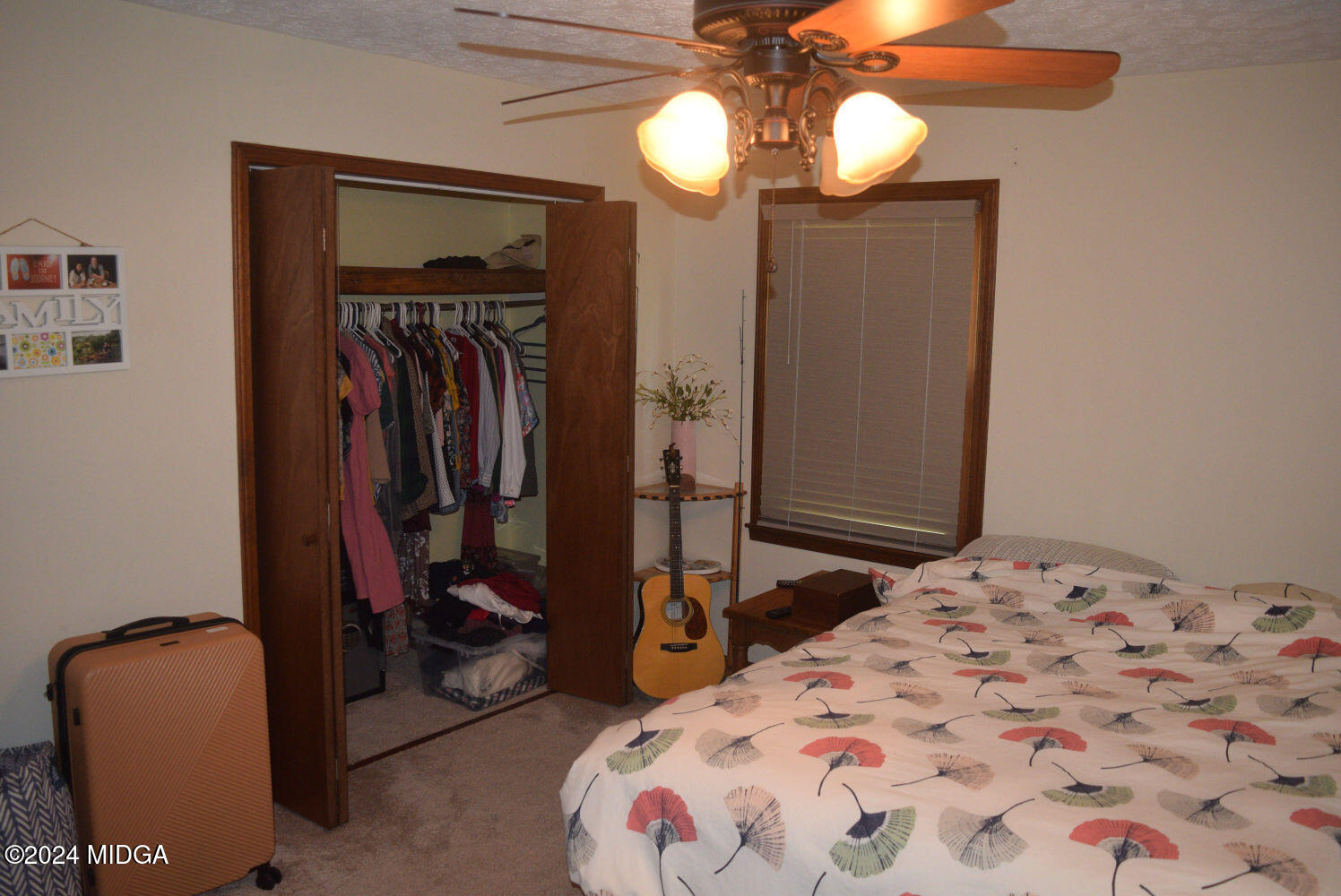 891 Walker Road Byron, GA 31008 - Photo 8 of 24 a bedroom with a bed and a mirror