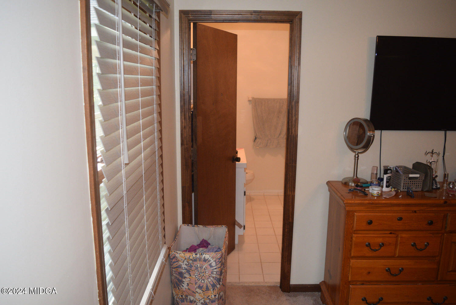 891 Walker Road Byron, GA 31008 - Photo 10 of 24 a bathroom with a sink and a mirror