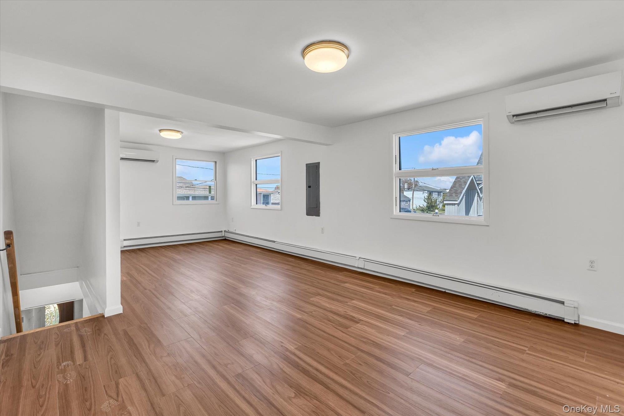 24 Milton Road Babylon, NY 11702 - Photo 25 of 30 a view of a room with wooden floor and window
