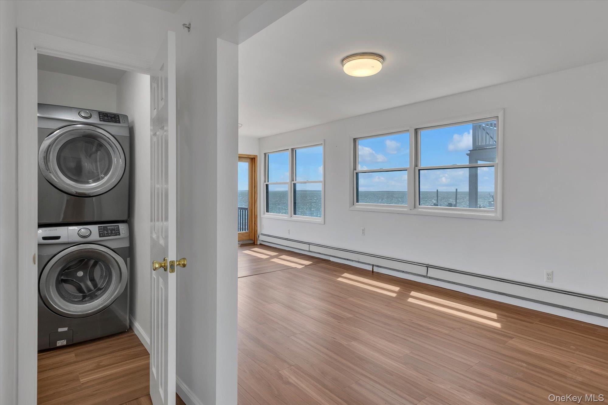 24 Milton Road Babylon, NY 11702 - Photo 27 of 30 a view of empty room with wooden floor and fan
