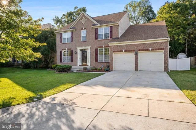 a front view of a house with yard