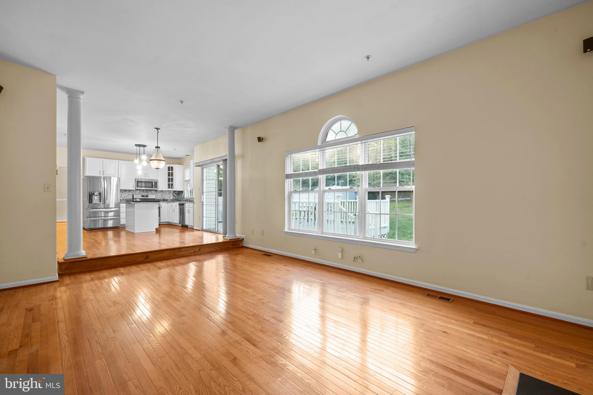 6514 Manton Way Lanham, MD 20706 - Photo 11 of 24 a view of an empty room with wooden floor and a window
