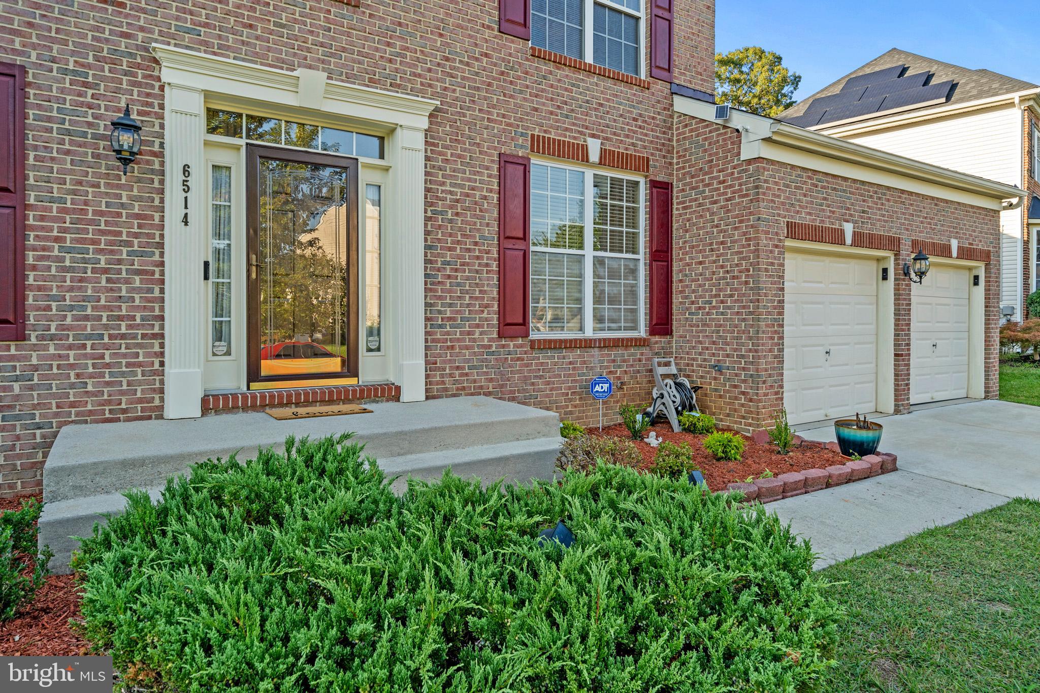 6514 Manton Way Lanham, MD 20706 - Photo 2 of 24 a front view of a house with a yard