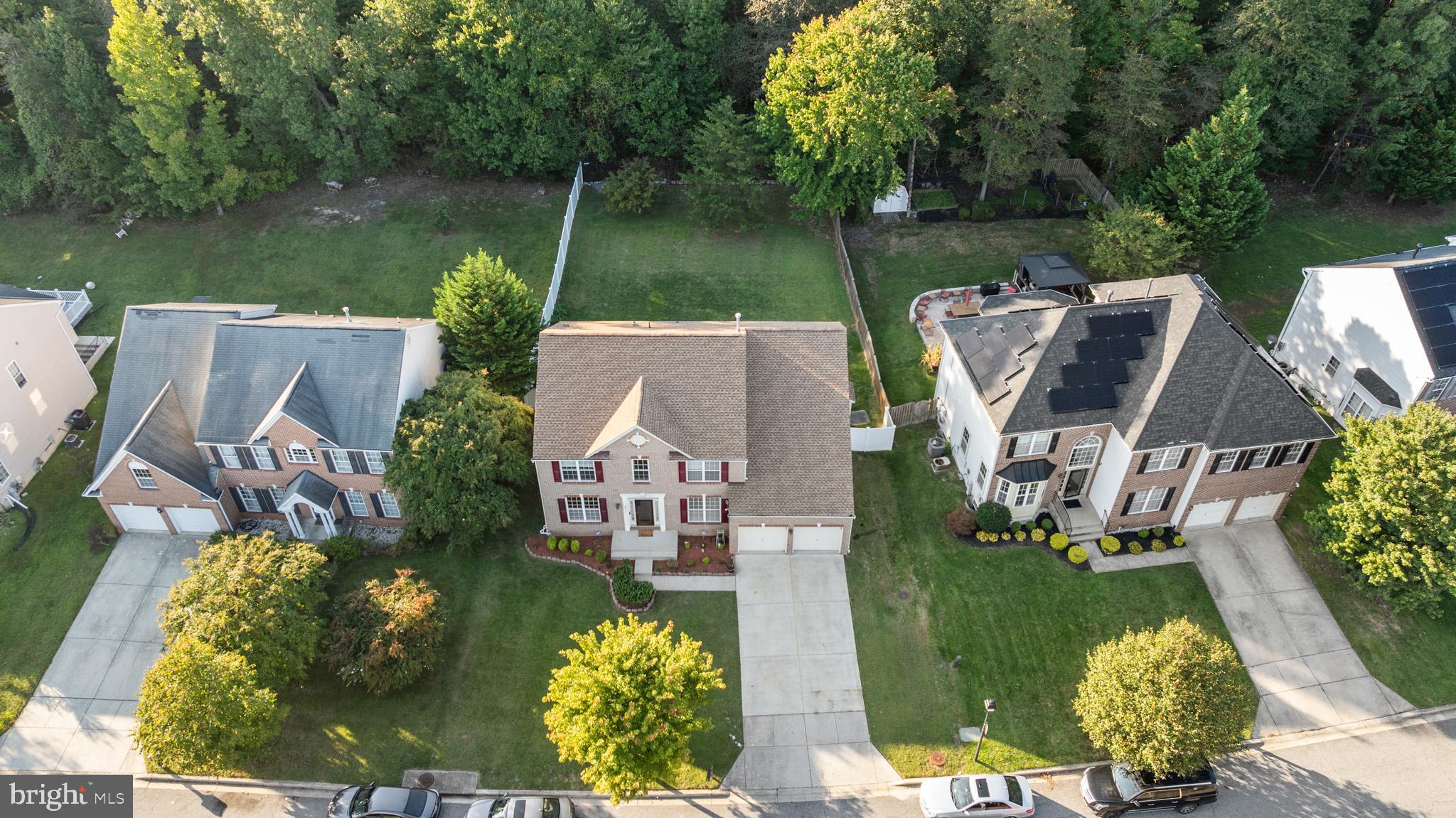 6514 Manton Way Lanham, MD 20706 - Photo 3 of 24 an aerial view of a house with swimming pool garden and patio