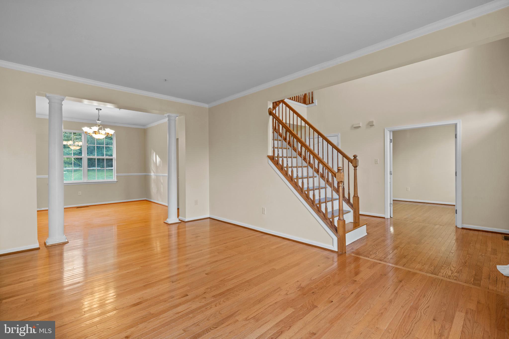 6514 Manton Way Lanham, MD 20706 - Photo 5 of 24 a view of an entryway with wooden floor and stairs