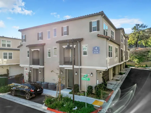 a view of multiple houses with a street