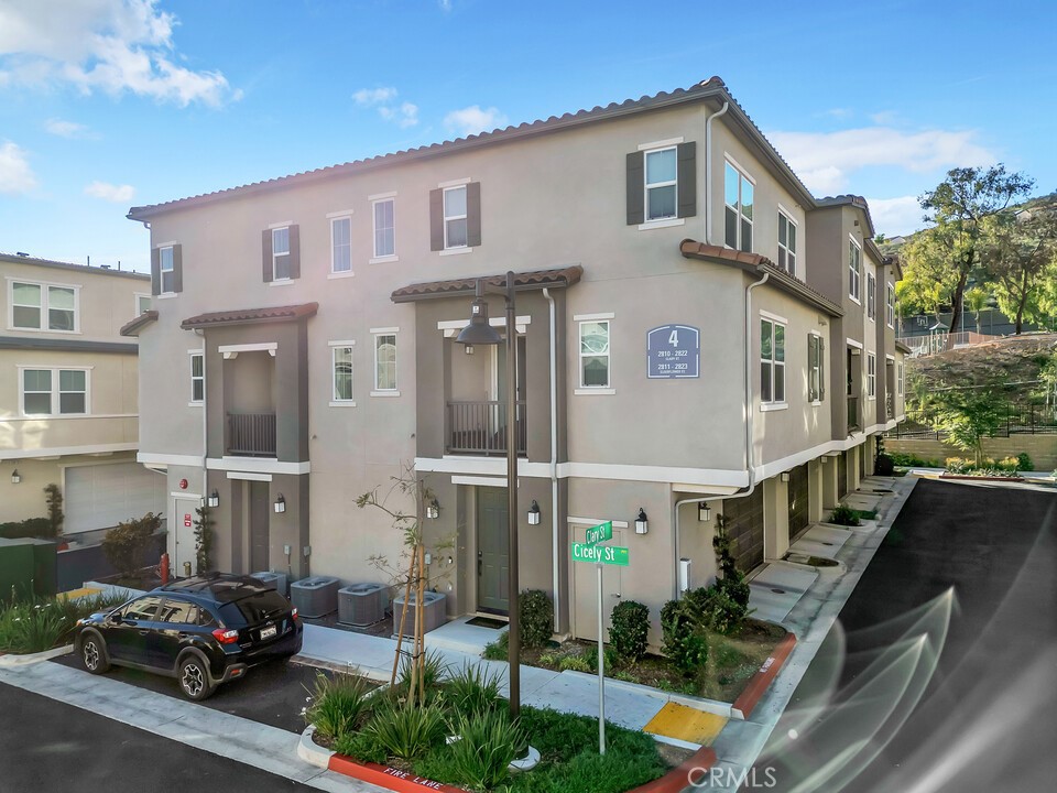 a view of multiple houses with a street