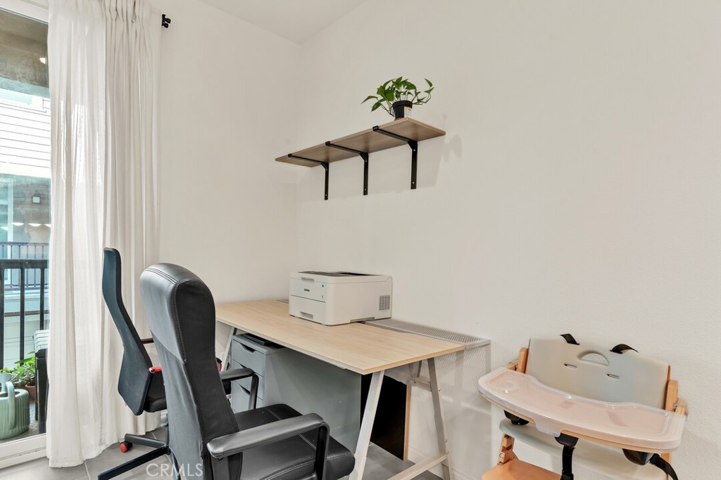 2814 Clary Street Spring Valley, CA 91977 - Photo 11 of 35 a view of workspace filled with furniture and wooden floor