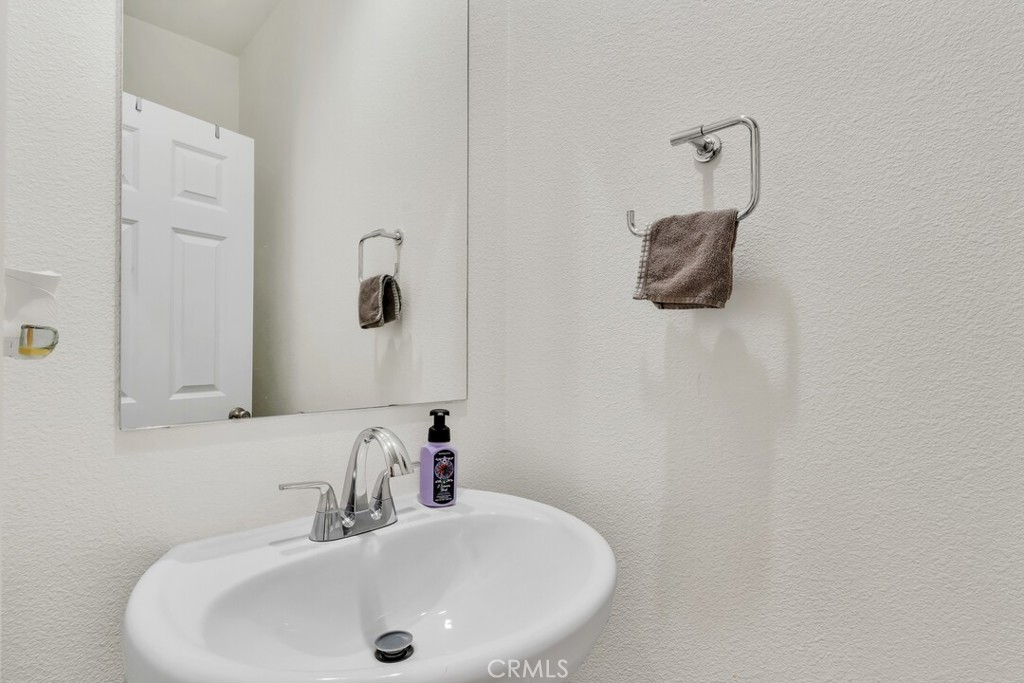 2814 Clary Street Spring Valley, CA 91977 - Photo 19 of 35 a bathroom with a sink and mirror