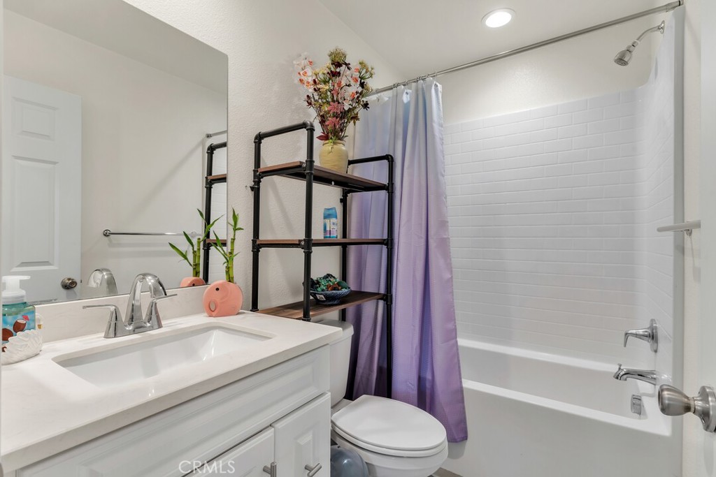 2814 Clary Street Spring Valley, CA 91977 - Photo 22 of 35 a bathroom with a sink a toilet and shower