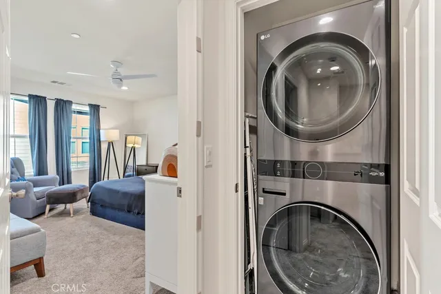 a bedroom with a large bed and a couch