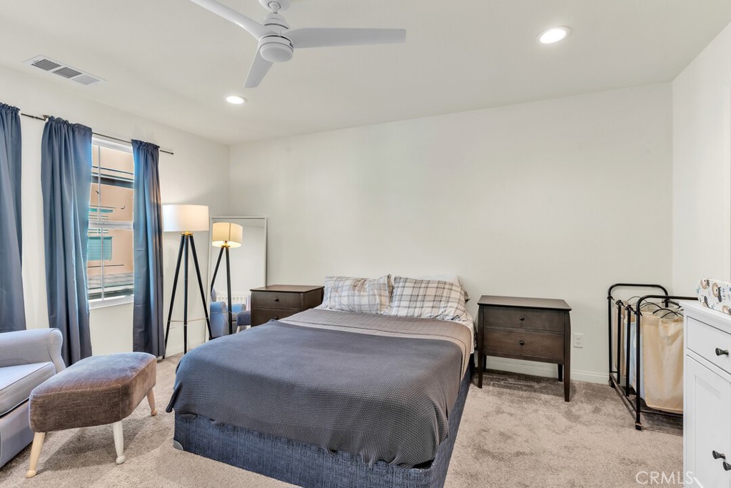 2814 Clary Street Spring Valley, CA 91977 - Photo 26 of 35 a bedroom with a bed and a mirror