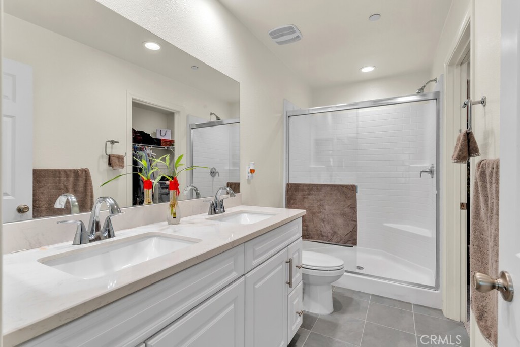 2814 Clary Street Spring Valley, CA 91977 - Photo 27 of 35 a bathroom with a sink a toilet and shower