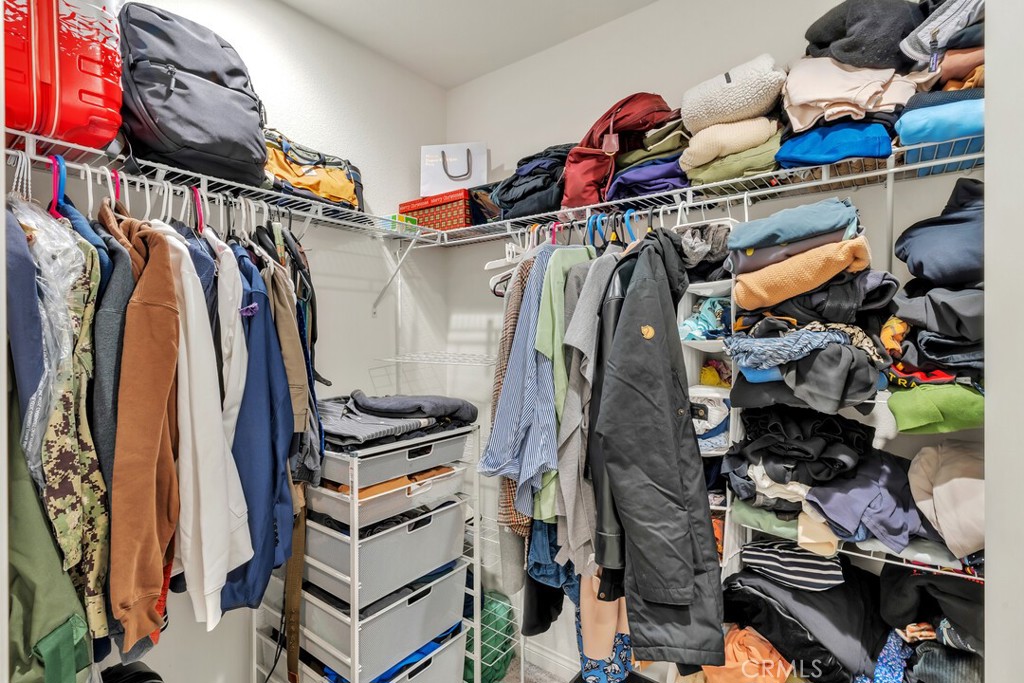 2814 Clary Street Spring Valley, CA 91977 - Photo 28 of 35 a view of walk in closet with clothes and shoes