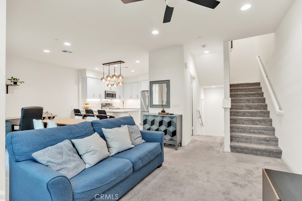 2814 Clary Street Spring Valley, CA 91977 - Photo 6 of 35 a living room with furniture and a chandelier