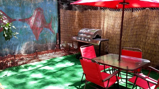 a backyard of a house with outdoor seating