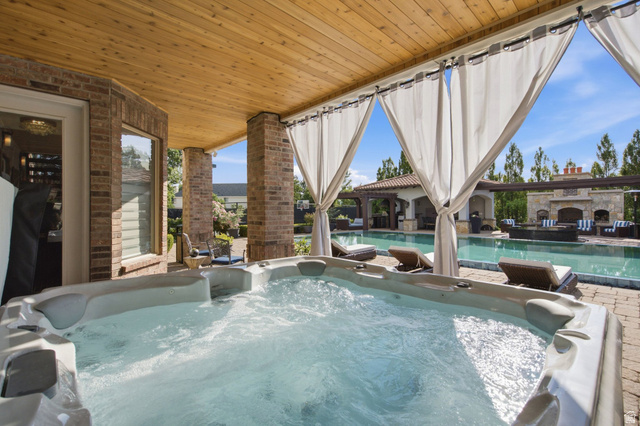 12308 Mariah Circle Draper, UT 84020 - Photo 122 of 293 Covered outdoor spa featuring a wood-finish ceiling, brick columns, privacy drapes, and a paver patio