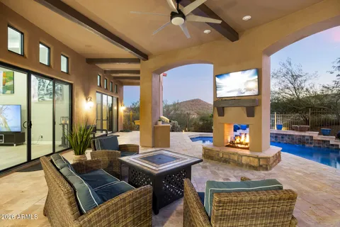 a living room with furniture large window and flat screen tv