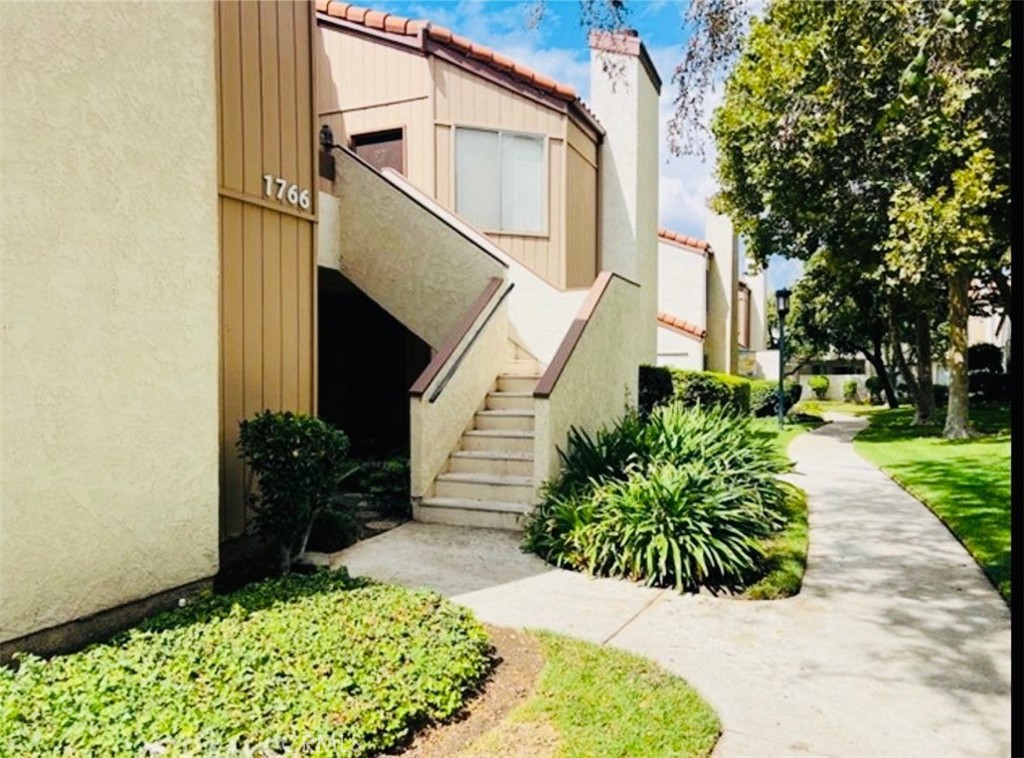 1766 Sinaloa Road, Unit 177 Simi Valley, CA 93065 - Photo 11 of 13 a front view of a house with garden
