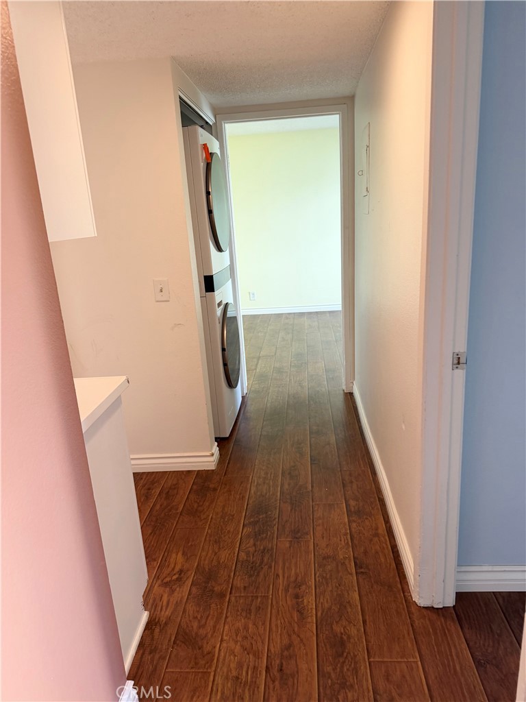 1766 Sinaloa Road, Unit 177 Simi Valley, CA 93065 - Photo 11 of 12 a view of a hallway with wooden floor and staircase