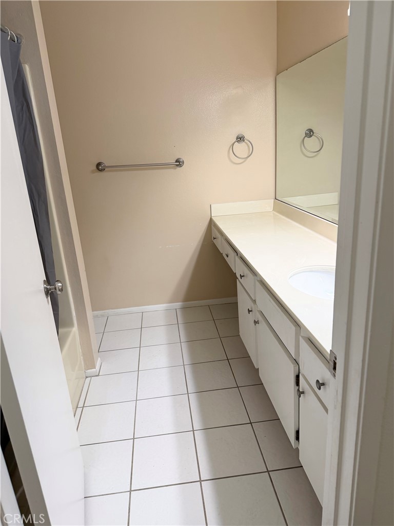 1766 Sinaloa Road, Unit 177 Simi Valley, CA 93065 - Photo 12 of 12 a bathroom with a sink a toilet and a mirror