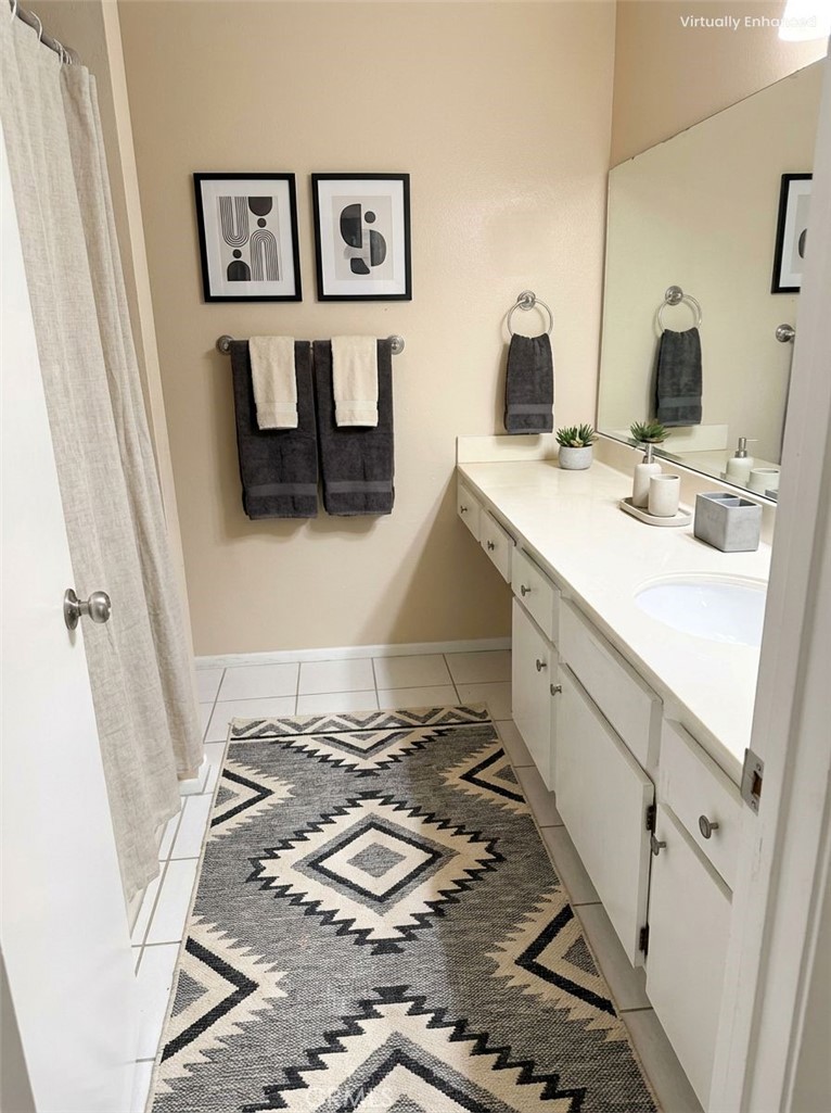 1766 Sinaloa Road, Unit 177 Simi Valley, CA 93065 - Photo 7 of 13 a bathroom with a sink and a mirror