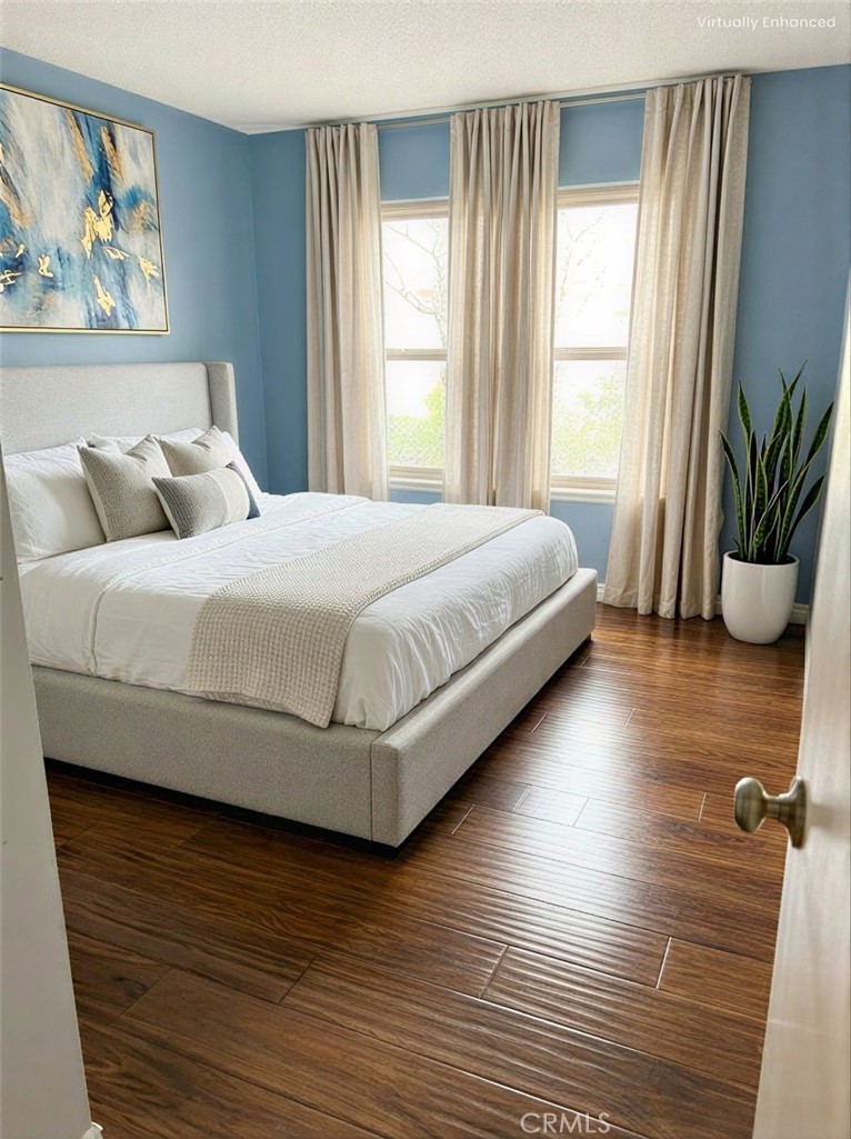 1766 Sinaloa Road, Unit 177 Simi Valley, CA 93065 - Photo 8 of 13 a bedroom with a bed and a large window