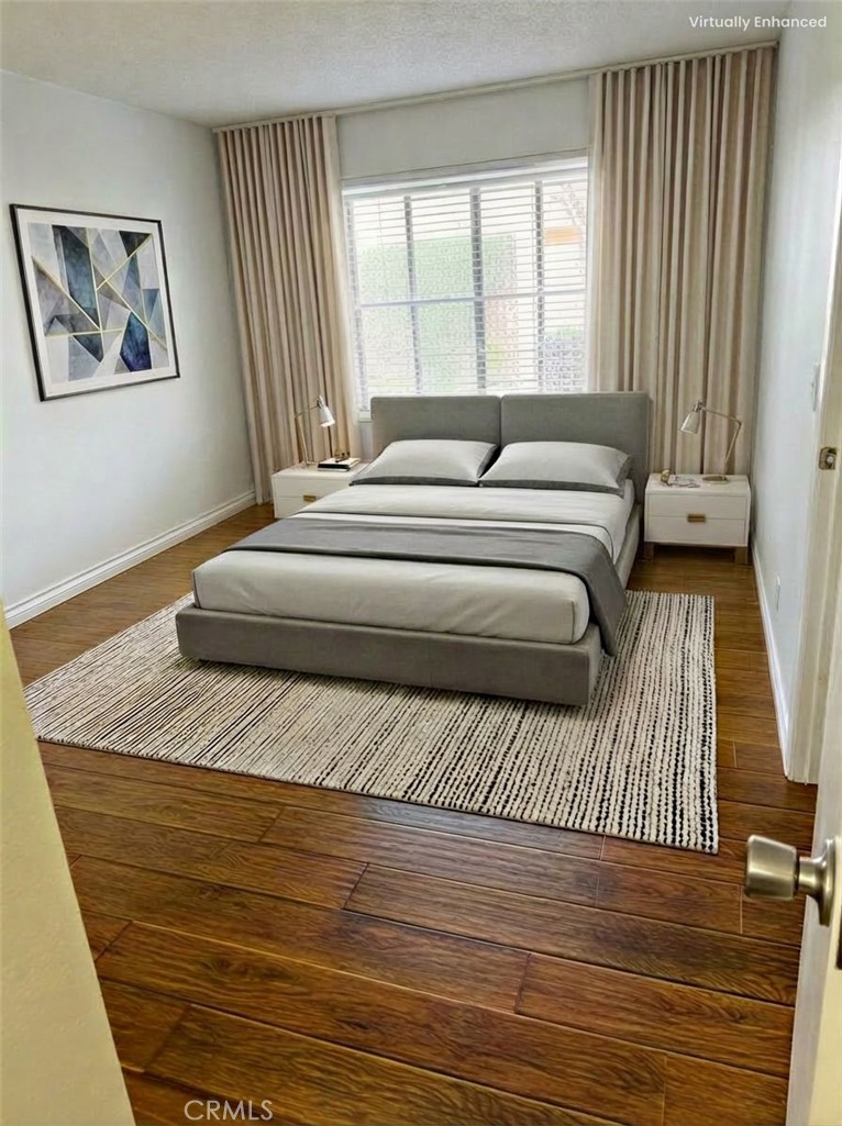 1766 Sinaloa Road, Unit 177 Simi Valley, CA 93065 - Photo 9 of 13 a bedroom with a bed and wooden floor