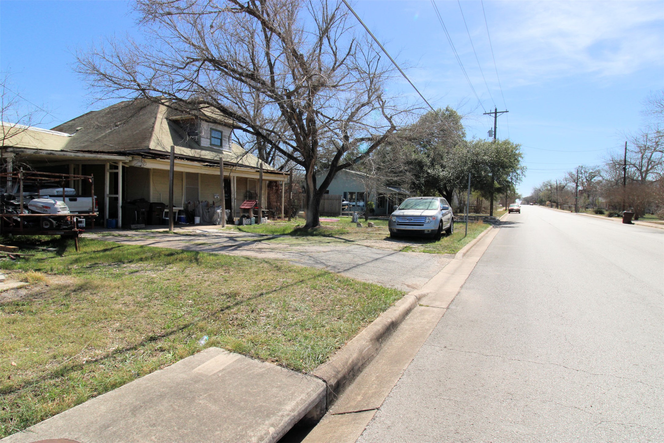 Front of home and view of Trinity St