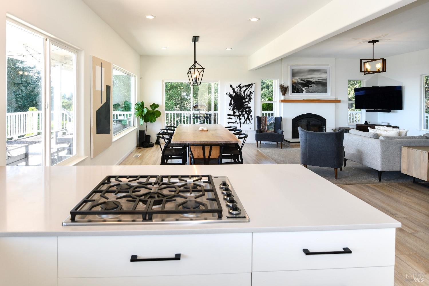 540 Edgemont Lane Angwin, CA 94508 - Photo 17 of 40 a kitchen with furniture a flat screen tv and a fireplace