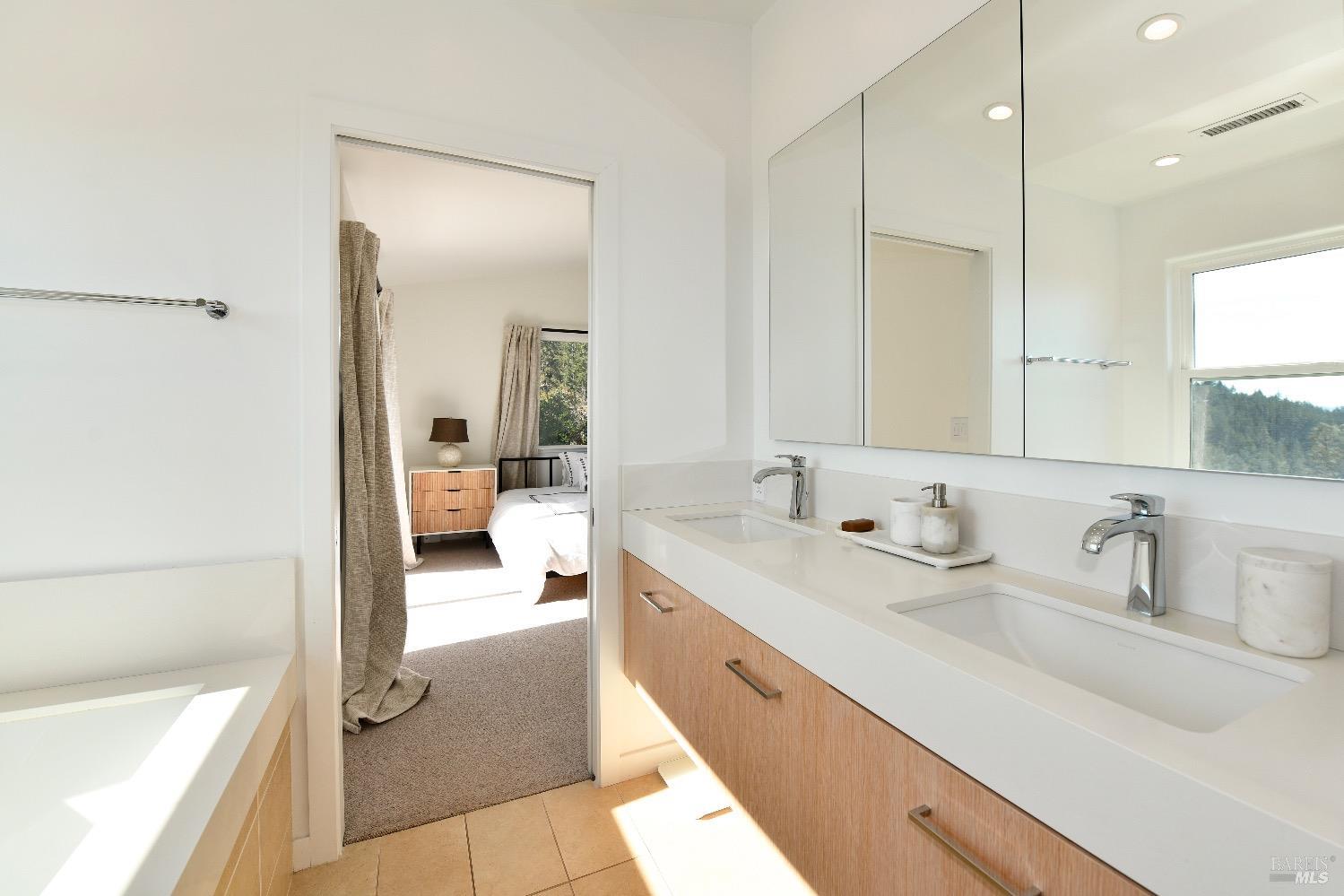 540 Edgemont Lane Angwin, CA 94508 - Photo 21 of 40 a en suite bathroom with a tub sink and mirror