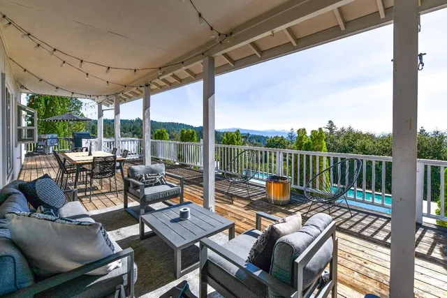 a view of a patio with a table and chairs