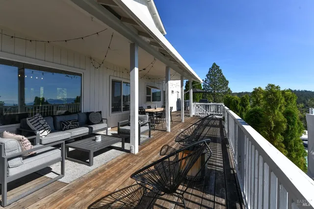a view of a patio with couches table and chairs