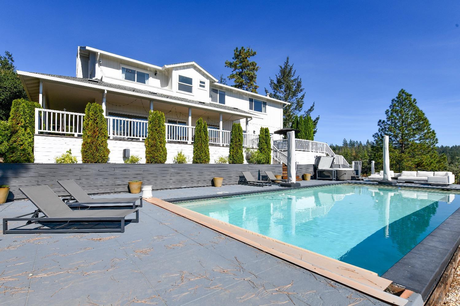540 Edgemont Lane Angwin, CA 94508 - Photo 3 of 40 a view of a house with swimming pool and sitting area