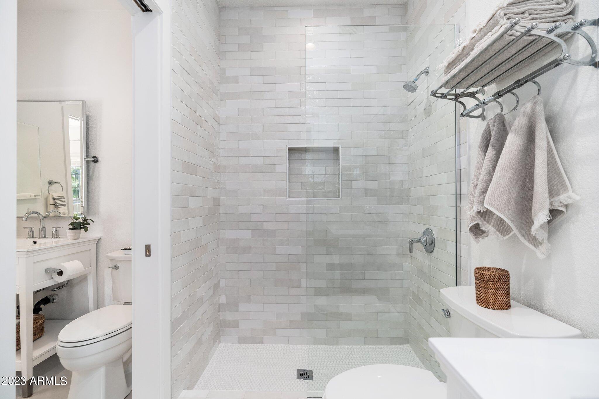 7710 East Gainey Ranch Road, Unit 259 Scottsdale, AZ 85258 - Photo 17 of 48 a bathroom with a shower and a toilet