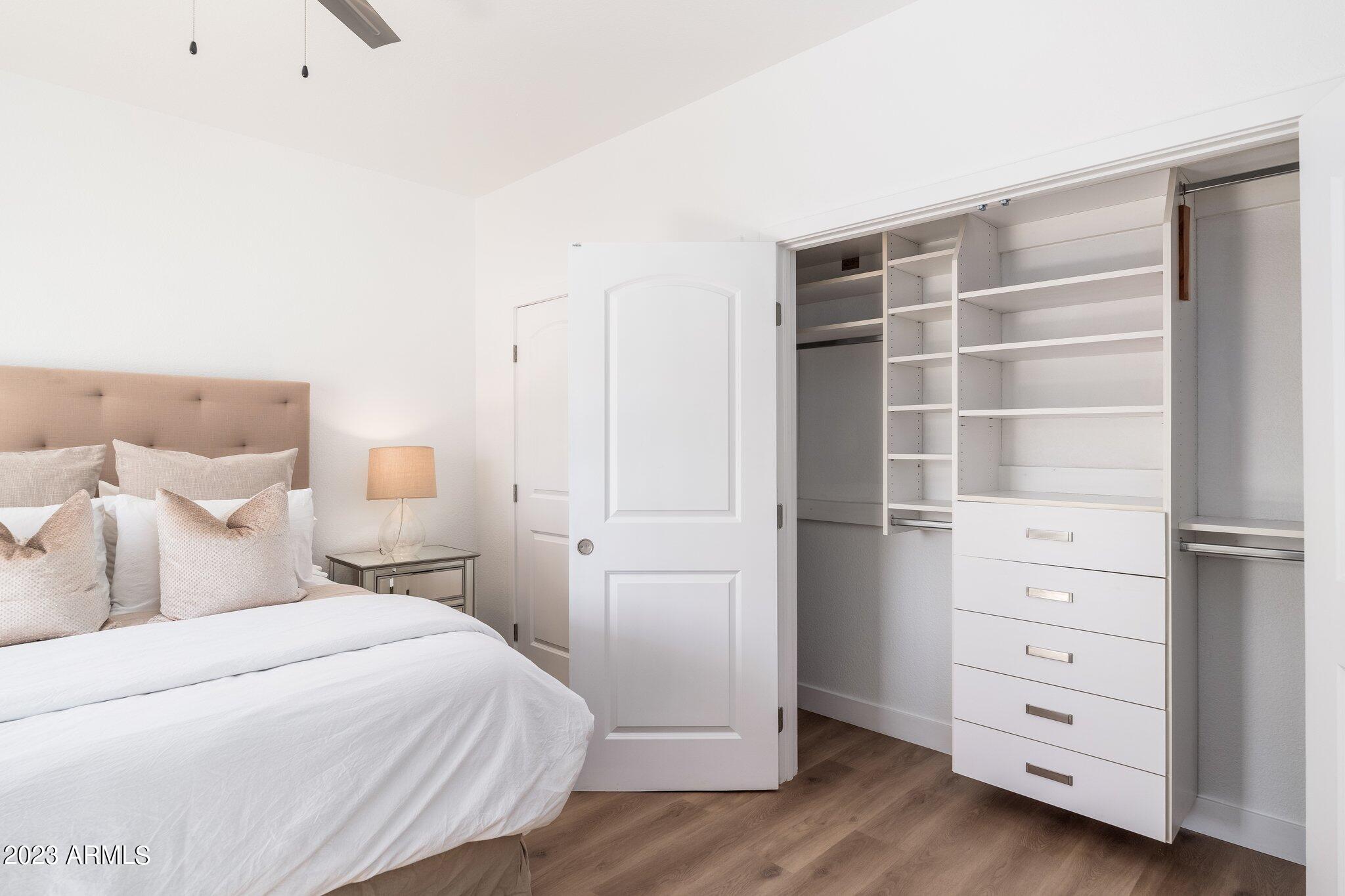7710 East Gainey Ranch Road, Unit 259 Scottsdale, AZ 85258 - Photo 24 of 48 a bedroom with a bed and a closet