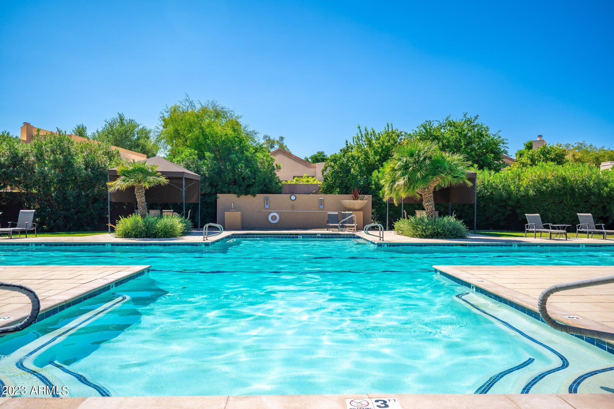 7710 East Gainey Ranch Road, Unit 259 Scottsdale, AZ 85258 - Photo 30 of 48 a view of a house with a yard