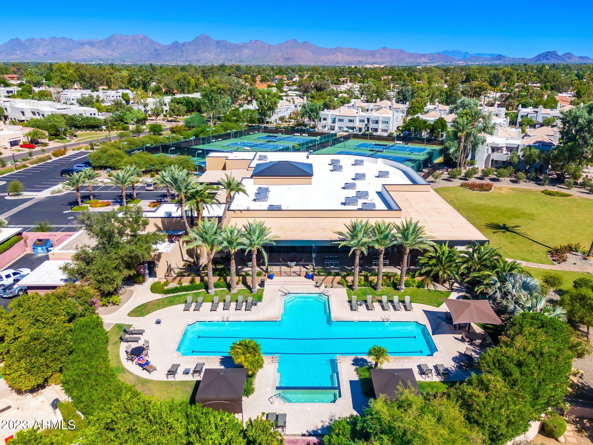7710 East Gainey Ranch Road, Unit 259 Scottsdale, AZ 85258 - Photo 45 of 48 an aerial view of residential houses with outdoor space and swimming pool